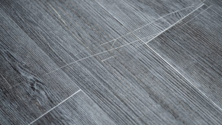 An Inexpensive Solution to Conceal Vinyl Floor Scratches and Restore Their Shine