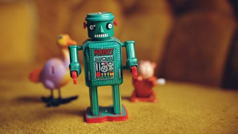 green metal toy robot