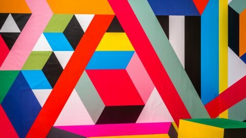 A wall mural of colourful colliding lines